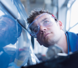 Technician inspecting car. CREDIT_iStock-88583403